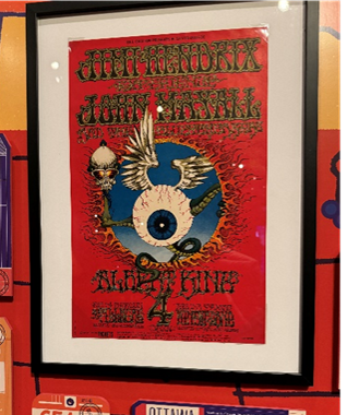 Framed vintage concert poster with intricate psychedelic art, featuring Jimi Hendrix and John Mayall, a classic collectible piece reflecting the iconic music era.